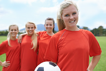 Image showing Team, players and portrait with soccer ball, happy and football field for match, competition or game. Young, practice or confident for training, outdoor or exercise for athlete, girls and sport