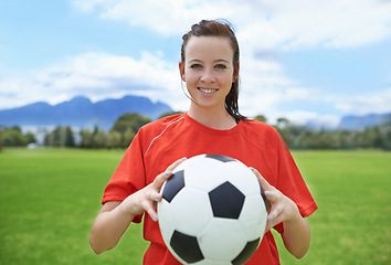 Image showing Woman, soccer player and portrait with ball, confident and football field for match, competition or game. Fitness, practice and ready for training, outdoor and exercise for athlete, strong or sport