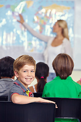 Image showing Kid, portrait and classroom with teacher for education, teaching and geography lesson or support in primary school. Face of a boy, child or students for learning, map information and world knowledge