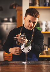 Image showing Barman making an alcoholic drink