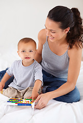 Image showing Abacus, portrait and baby with mother playing, learning and education for child development on bed. Bonding, toy and young mom teaching kid, infant or toddler counting for math in bedroom at home