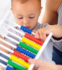 Image showing Abacus, math and baby with mom playing, learning and teaching for child development on bed. Bonding, toy and closeup of mother teaching kid, infant or toddler with counting in bedroom at home.