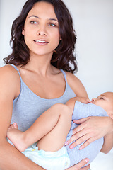 Image showing Mom holding baby in home for sleep, bonding and child care with support in morning. Happy woman, toddler boy and bedtime together in apartment with development, fatigue and safety with mothers love.