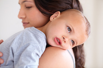 Image showing Mom holding baby boy in home for sleep, bonding and child care with support in morning. Woman, tired toddler and nap time together in bedroom with development, trust and safety with mothers love.