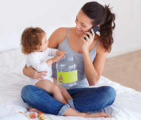Image showing Happy, mom and phone call with baby in home talking on bed with child playing with toys, Smartphone, conversation and mother speaking online, communication and caring for kid in bedroom with blocks