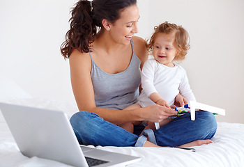Image showing Learning, baby and happy mother on laptop in bedroom for online education or remote work at home. Freelancer mom, computer and kid in bed playing with abacus, care and toddler together with family