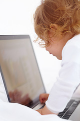 Image showing Baby, learning and playing with laptop in home and cartoon, movies or games for education. Infant, kid and typing on computer in bedroom for child development, growth and website for elearning