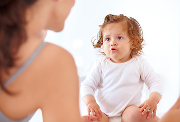 Image showing Bonding, mom and baby talking in home together with love, happiness and development of child, Kid, speaking and relax with mother in bedroom or morning with curious, learning and growth of toddler