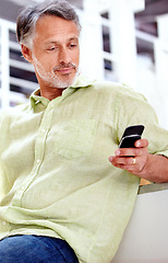 Image showing Relax, couch or mature man with phone for social media, message or news update with notification. Technology, chat or senior entrepreneur with mobile app for networking, communication or texting