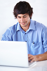 Image showing Man, worker and satisfied with laptop, happy and studio background for company, employee and digital. Agency ,internet and online for email, news or technology with face, job or reading for business