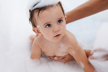 Image showing Baby, water and soap for washing in bathroom, bath and cleaning for skincare at home. Person, toddler and childcare or hygiene for prevention of bacteria and virus, cosmetics and liquid for care