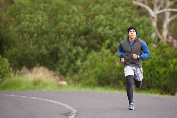 Image showing Fitness, energy and a man in the street for running, training and marathon competition. Health, exercise and a male runner or athlete in the road for sports, morning cardio or a workout in nature