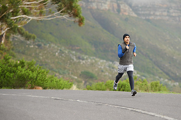 Image showing Fitness, exercise and a man in the street for running, training and marathon competition. Health, energy and a male runner or athlete in the road for sports, morning cardio or a workout in nature