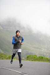 Image showing Fitness, health and a man in the street for running, training and marathon competition. Winter, energy and a male runner or athlete in the road for sports, morning cardio or a workout in nature