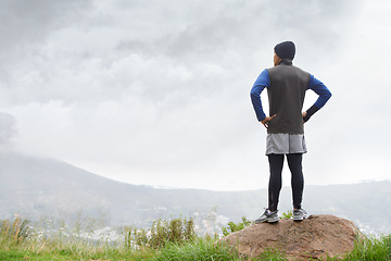 Image showing Runner thinking, fitness and man in nature for training , wellness or outdoor adventure for health. Athlete, back or sports person on mountain peak with idea or inspiration for exercise or workout