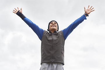 Image showing Happy man, runner or hands up for celebration in training adventure, exercise or workout success. Excited, sky or healthy hiker with smile, gratitude or freedom for fitness to explore nature outdoors