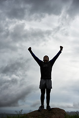 Image showing Happy man, mountain peak or hands up for celebration in training, exercise or workout success. Excited athlete, sky or healthy hiker with cheering, gratitude or freedom in nature for fitness