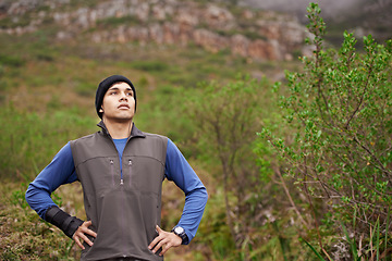 Image showing Man, hiking and thinking for adventure, mountain and face for trail, exercise and workout. Hiker, fitness and climber for training, forest and nature to explore, hobby and heart health in outdoors