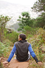 Image showing Back, rock and man on break in nature training, cardio exercise and endurance workout for wellness. Sports person, fitness fatigue or tired athlete resting in forest or mountain trail outdoors