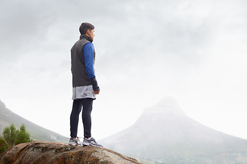 Image showing Man, mountain peak space or thinking for adventure, mockup or trail in exercise or workout. Hiker, sky or climber training in nature to explore hiking for wellness, fitness or heart health outdoors