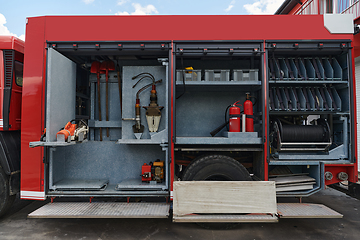 Image showing Close-up of essential firefighting equipment on a modern firetruck, showcasing tools and gear ready for emergency response to hazardous fire situations