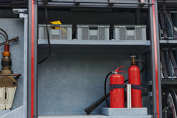 Image showing Close-up of essential firefighting equipment on a modern firetruck, showcasing tools and gear ready for emergency response to hazardous fire situations