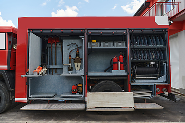 Image showing Close-up of essential firefighting equipment on a modern firetruck, showcasing tools and gear ready for emergency response to hazardous fire situations