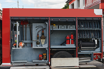 Image showing Close-up of essential firefighting equipment on a modern firetruck, showcasing tools and gear ready for emergency response to hazardous fire situations