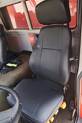 Image showing The close-up capture reveals the intricate details of the ergonomic seats and high-tech interior of a modern firefighting truck, showcasing a perfect blend of functionality and safety features