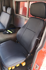 Image showing The close-up capture reveals the intricate details of the ergonomic seats and high-tech interior of a modern firefighting truck, showcasing a perfect blend of functionality and safety features