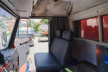 Image showing The close-up capture reveals the intricate details of the ergonomic seats and high-tech interior of a modern firefighting truck, showcasing a perfect blend of functionality and safety features