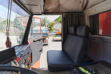 Image showing The close-up capture reveals the intricate details of the ergonomic seats and high-tech interior of a modern firefighting truck, showcasing a perfect blend of functionality and safety features