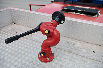 Image showing Close-up of essential firefighting equipment on a modern firetruck, showcasing tools and gear ready for emergency response to hazardous fire situations