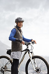 Image showing Smile, portrait and a man with a bike in nature for cycling, fitness and training in nature. Happy, health and a male biker or person with a bicycle for transportation, sport or an outdoor triathlon