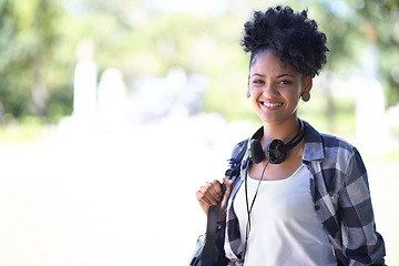 Image showing Woman, portrait and backpack on campus or headphones for entertainment, streaming or learning. Female person, face and student at college academy or outdoor nature for university, relax or summer