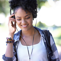 Image showing Woman, headphones and music on university campus for entertainment, listening or education. Female person, smile and backpack at college for scholarship student or subscription, track or streaming
