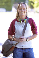 Image showing Portrait, woman and happy student at park, university or outdoor campus in summer. School, bag and smile of person at college for education, learning and young teenager or girl studying in Sweden