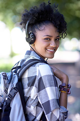 Image showing Woman, portrait and headphones on campus for music listening, entertainment or streaming. Female person, student and smile with backpack for study learning or outdoor for radio, relax or university