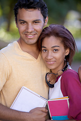 Image showing Student, couple and portrait with books at university campus for reading education, learning or literature. Man, woman and face smile at college academy or academic degree for future, growth or study