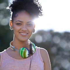 Image showing Portrait, student or happy woman at park with headphones at university campus outdoor in nature. Face, college and smile of girl or young person in education for learning to study at school in Brazil