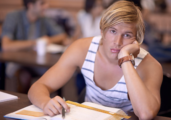 Image showing University, bored and portrait of man in classroom with books for studying, learning and research. Education, college and face of student tired, sad and upset with textbooks for assignment or test