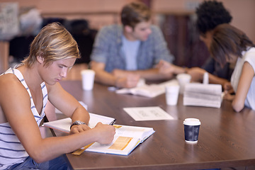 Image showing University, writing and man in library with books for studying, learning and research with knowledge. Education, college and male student with textbooks for assignment, project and test on campus