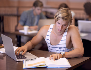 Image showing University, laptop and man with books in library for studying, learning and research for knowledge. Education, college and student on computer and textbook for assignment, project and test in campus