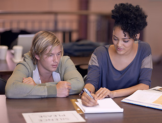 Image showing University, students and people in library with books for studying, learning and research for knowledge. Education, college and man and woman with textbooks for assignment, project and test on campus