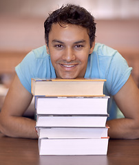 Image showing Student man, portrait and stack of books for education, development and happy at college library. Person, learning and knowledge with smile, pride and research for assessment at university campus