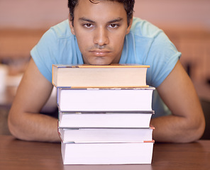 Image showing Student man, bored and stack of books for education, development or tired at college library. Person, learning or knowledge with anxiety, burnout or thinking for research with brain fog at university