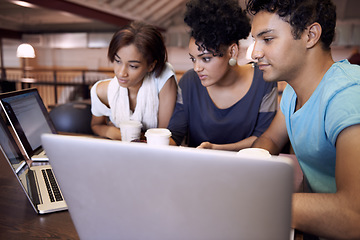 Image showing University, education and students in library on laptop for research, studying and learning on website. Online, college and man and women on computer for assignment, group project and internet