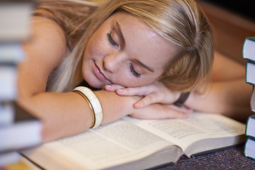 Image showing Student woman, sleeping and books at desk education, development and exhausted with fatigue in college library. Person, learning and rest with burnout, tired or mental health for exam at university