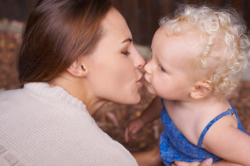 Image showing Mother, love and kiss of baby in house, trust and parent support for mama bond with happiness in care. Woman, nurture and toddler daughter with together, wellness and hug kid for bonding in apartment