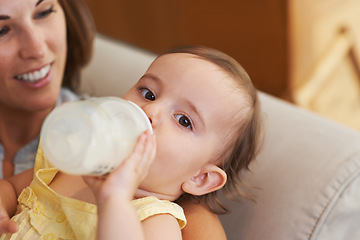 Image showing Baby, bottle and drinking milk, portrait and mom for meal, feeding and kid. Family time, eating and smile for nutrition, hungry and child in home, parent and care for growth, healthy and love